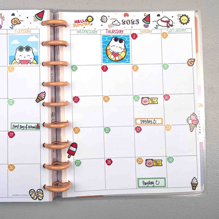 Planner with a colorful calendar page on a gray surface